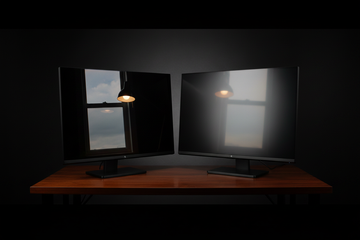 Side-by-side comparison of two high-end computer monitors, one with a glossy finish showing sharp reflections and the other with a matte finish showing diffused light.