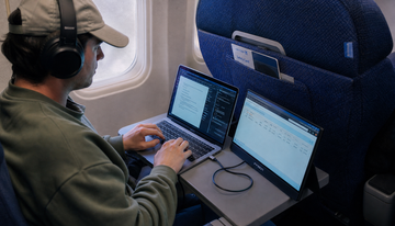 Can You Use a Portable Monitor on an Airplane Tray Table Without Disturbing Other Passengers?